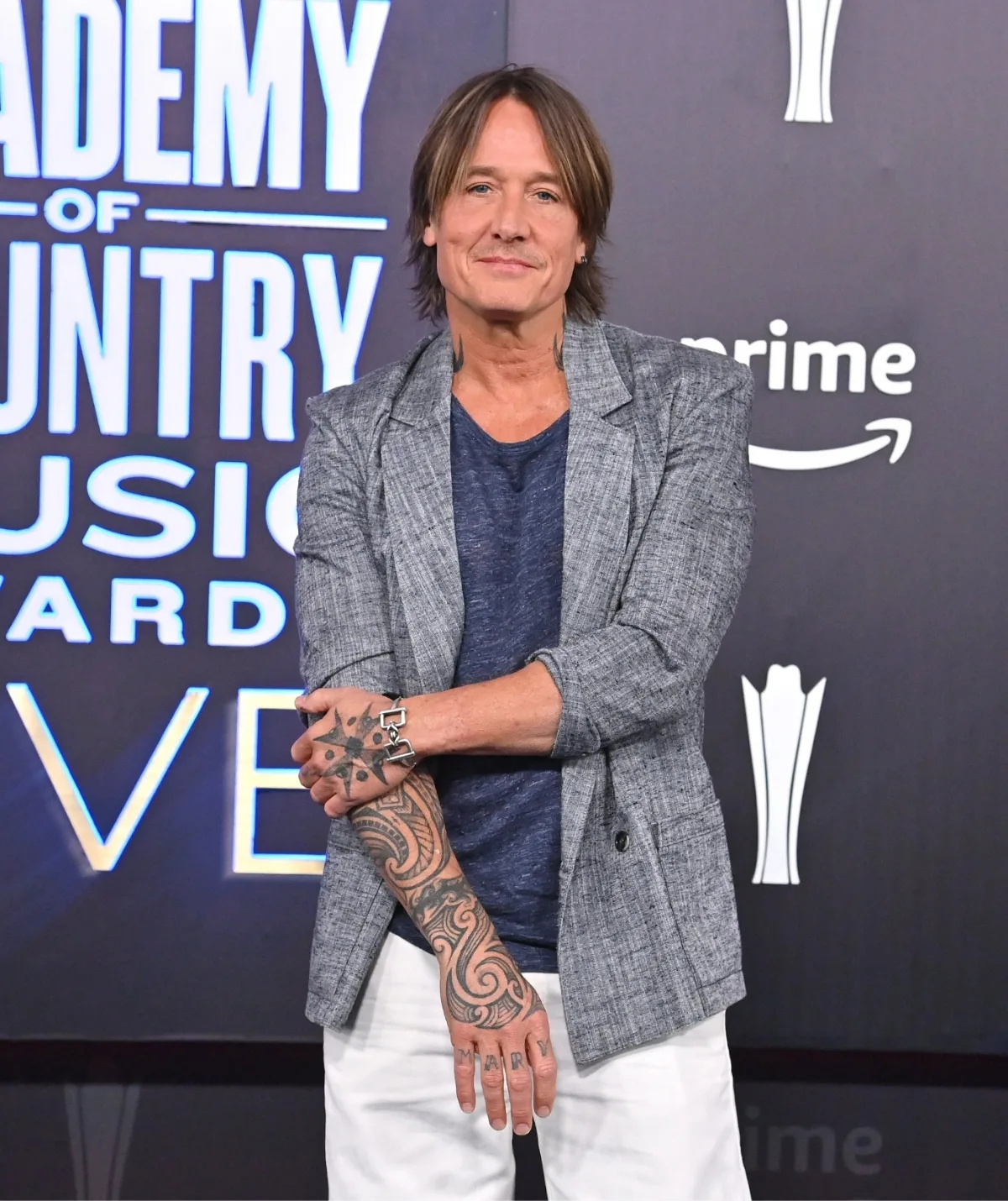 A middle aged man with tattoos