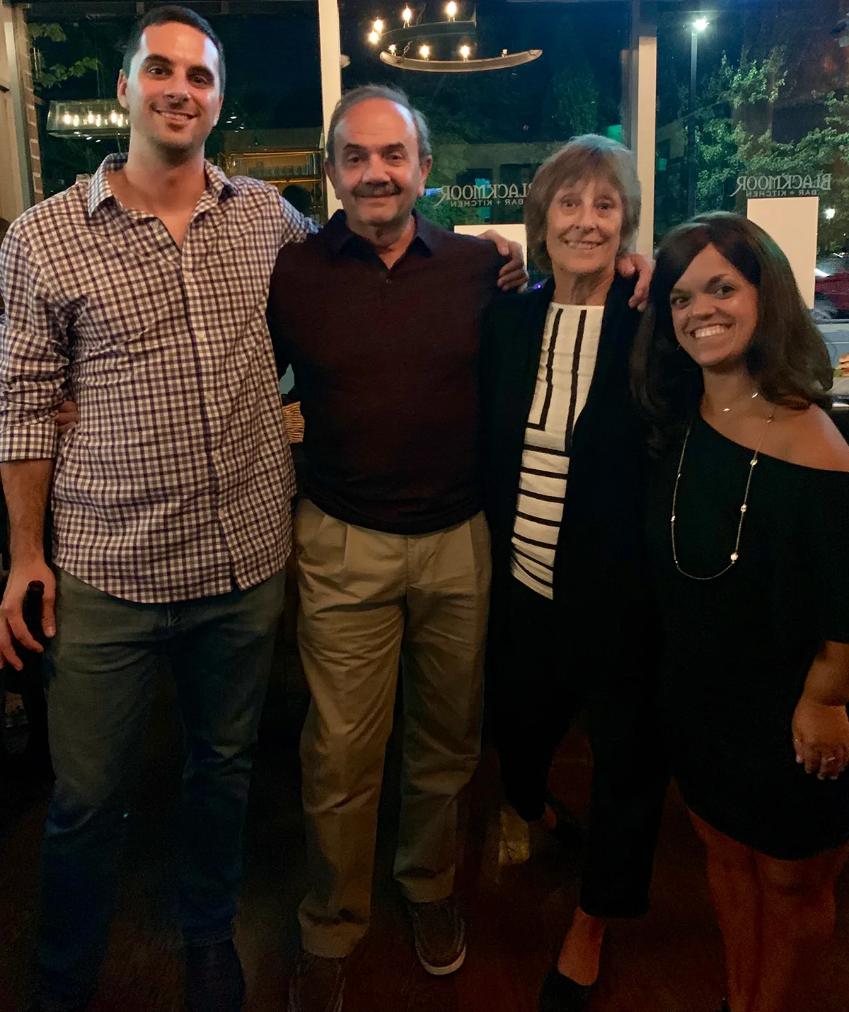 L-R, Brother Derek, dad Joe, mum Lynn and me. My family is everything. (Image: Supplied)