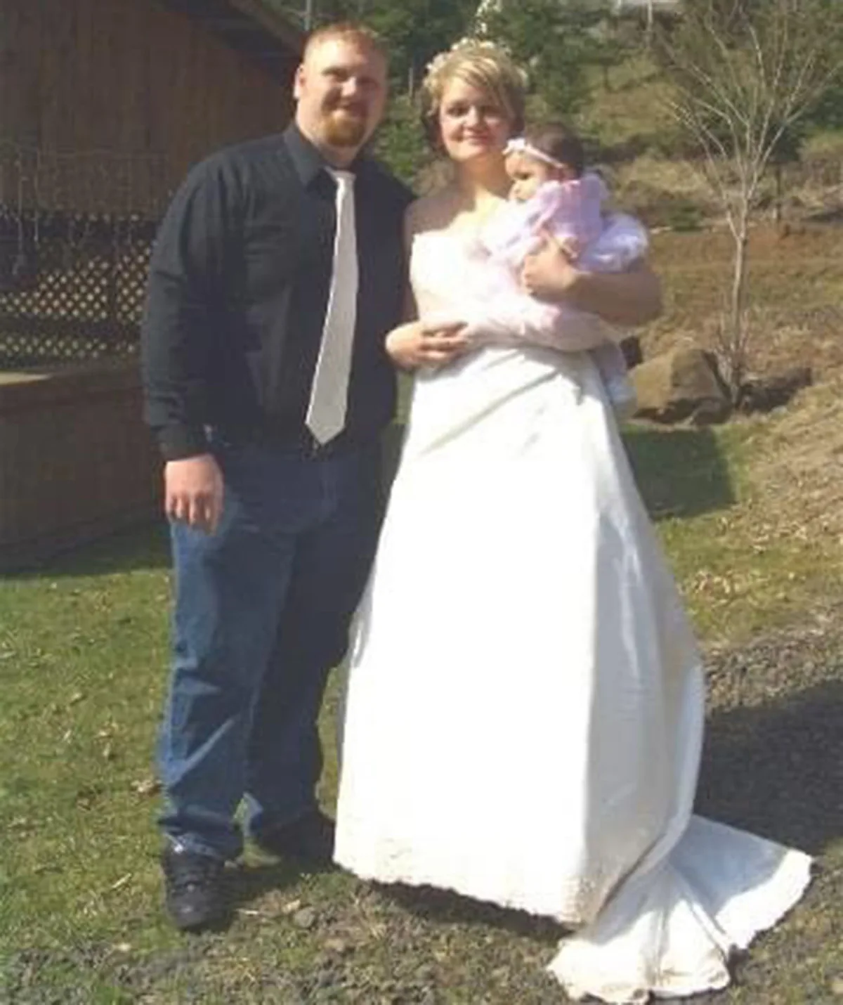 Derek, me and Gracie (8 months) on our wedding day. (Image: Supplied)