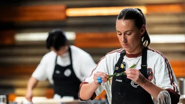 Annabel Lloyd focusing in the MasterChef Australia kitchen.