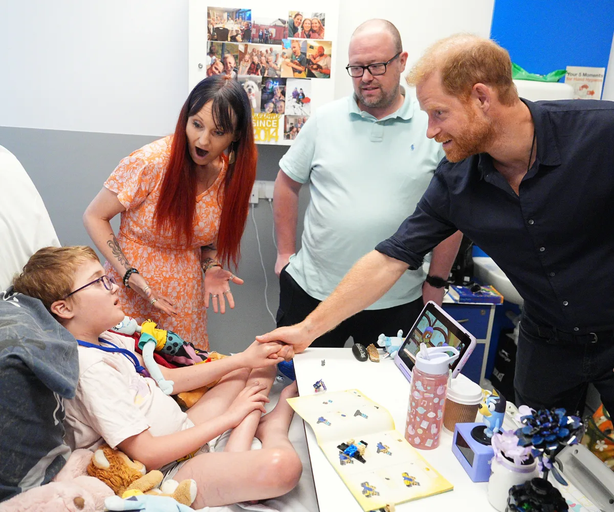 Prince Harry greets patient Alec Hill 
