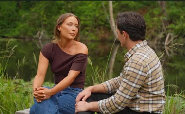 Rachel and Alex sit next to each other outside