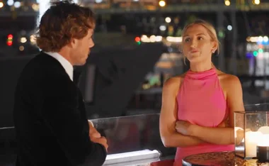 Keeley, arms folded, looks at Dylan