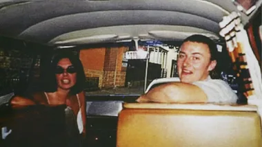 A young man and woman in a campervan