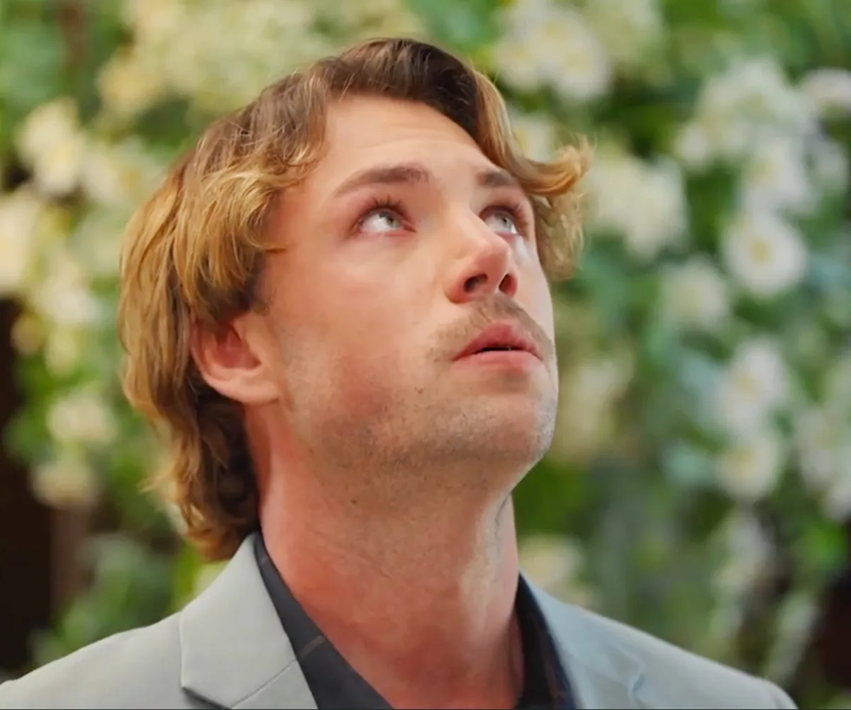 Dylan, with tears in his eyes, looks upward