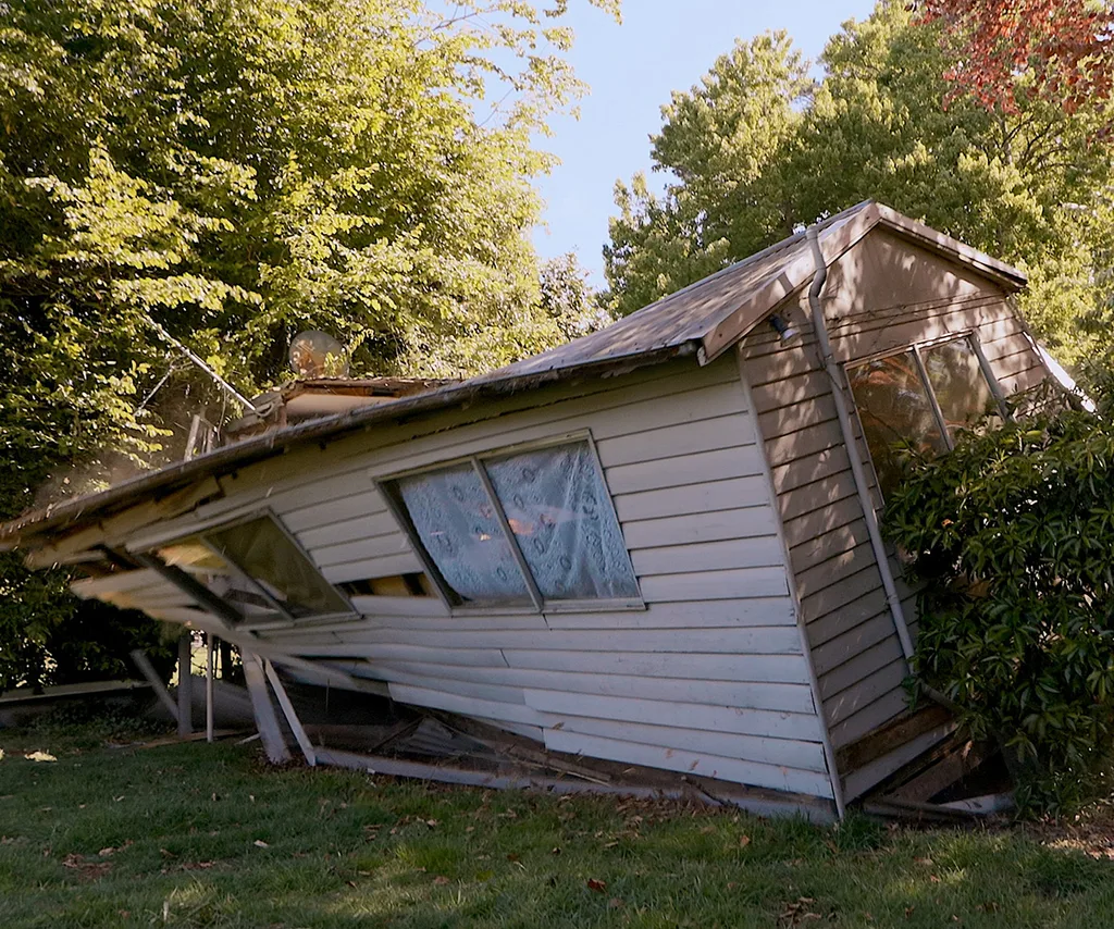 A cottage crumbles in The Birthday Trip.