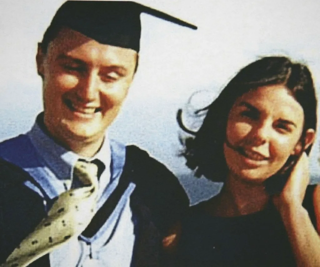 A man and woman smiling