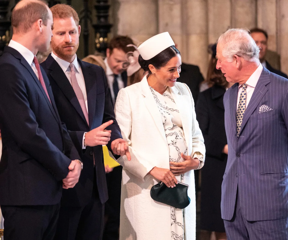 pregnant Meghan Markle and Prince Charles exchange smiles in 2019