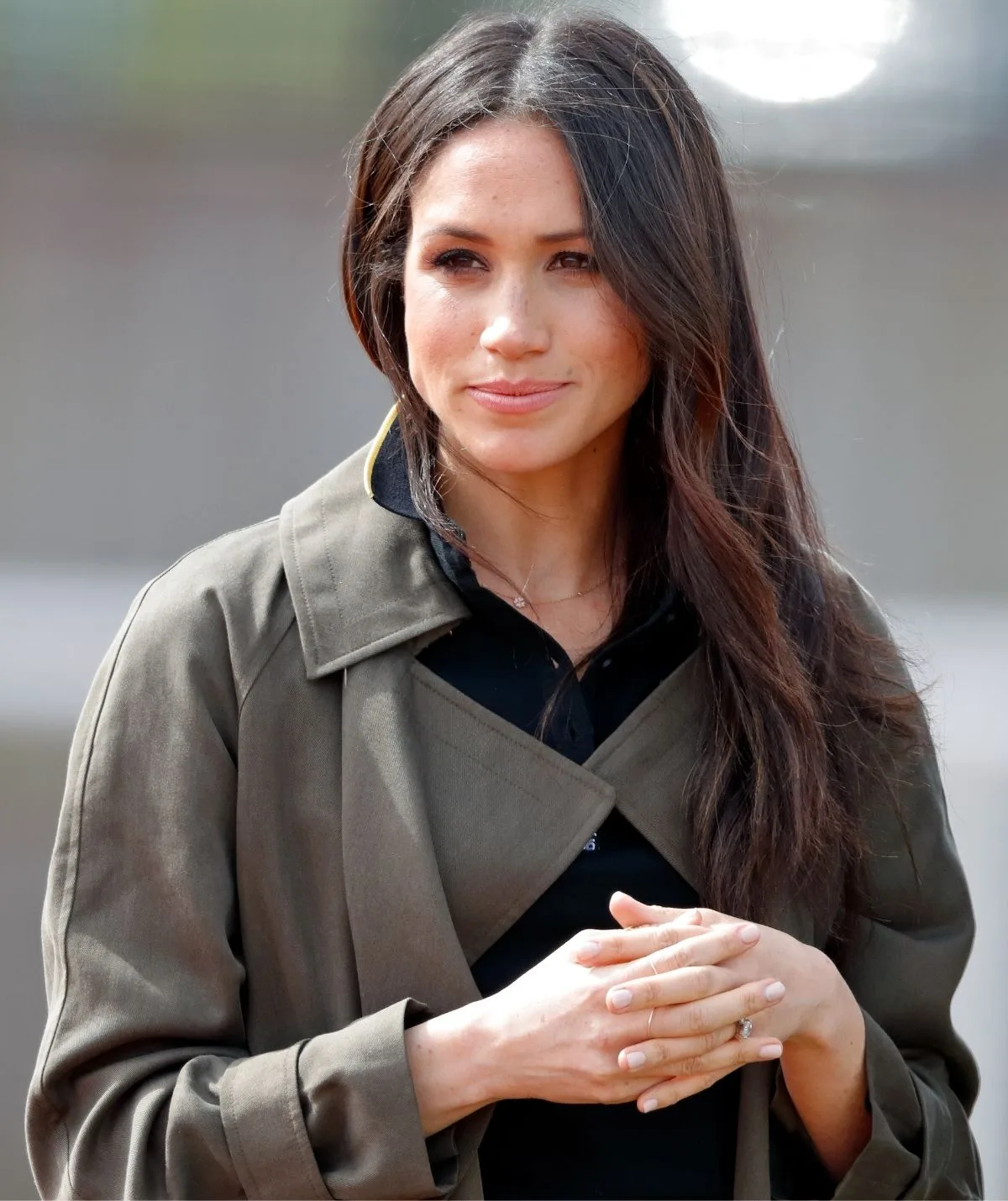 Duchess Meghan with a half smile on her face
