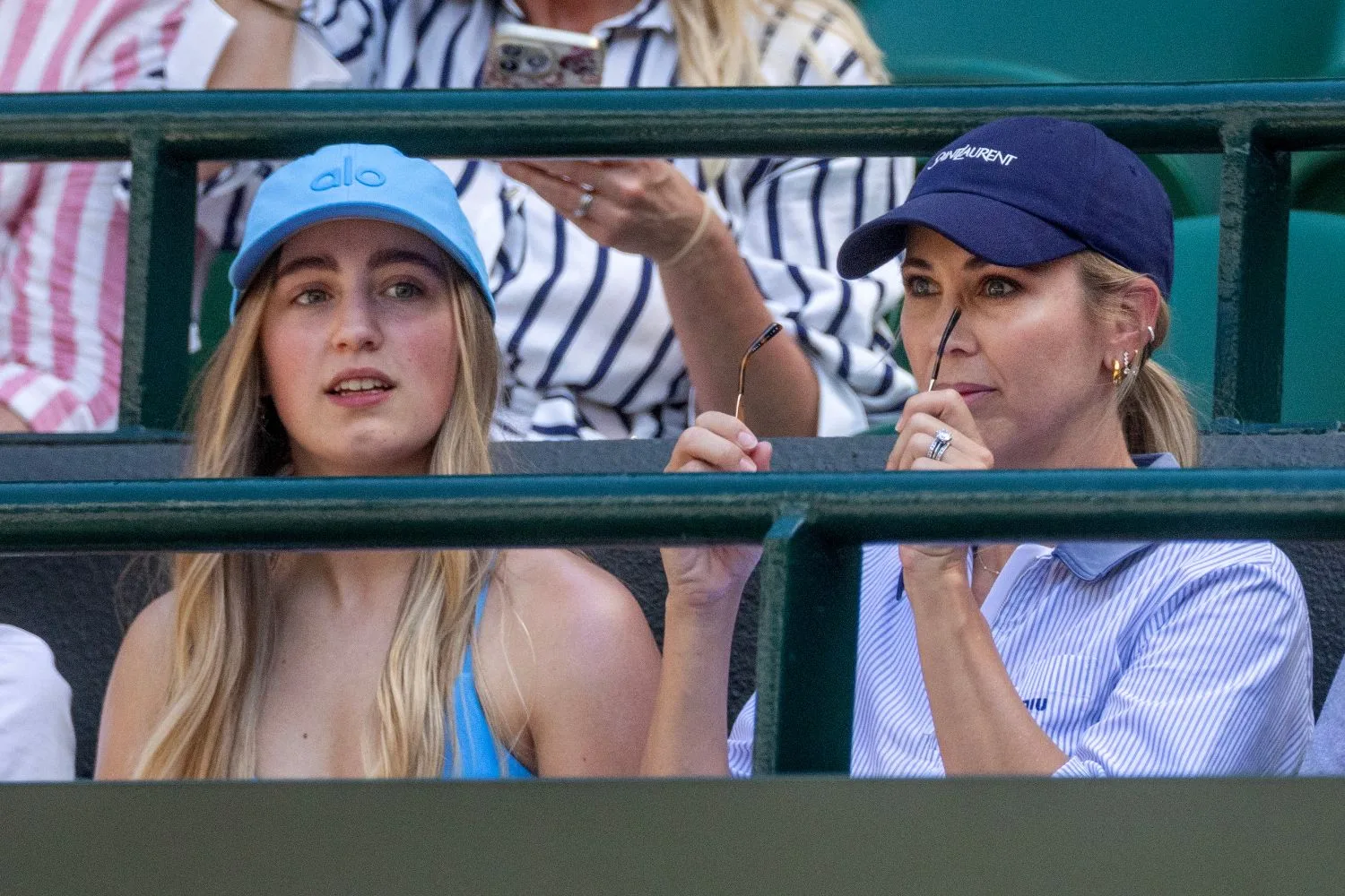 Bec Hewitt watches son Cruz play tennis