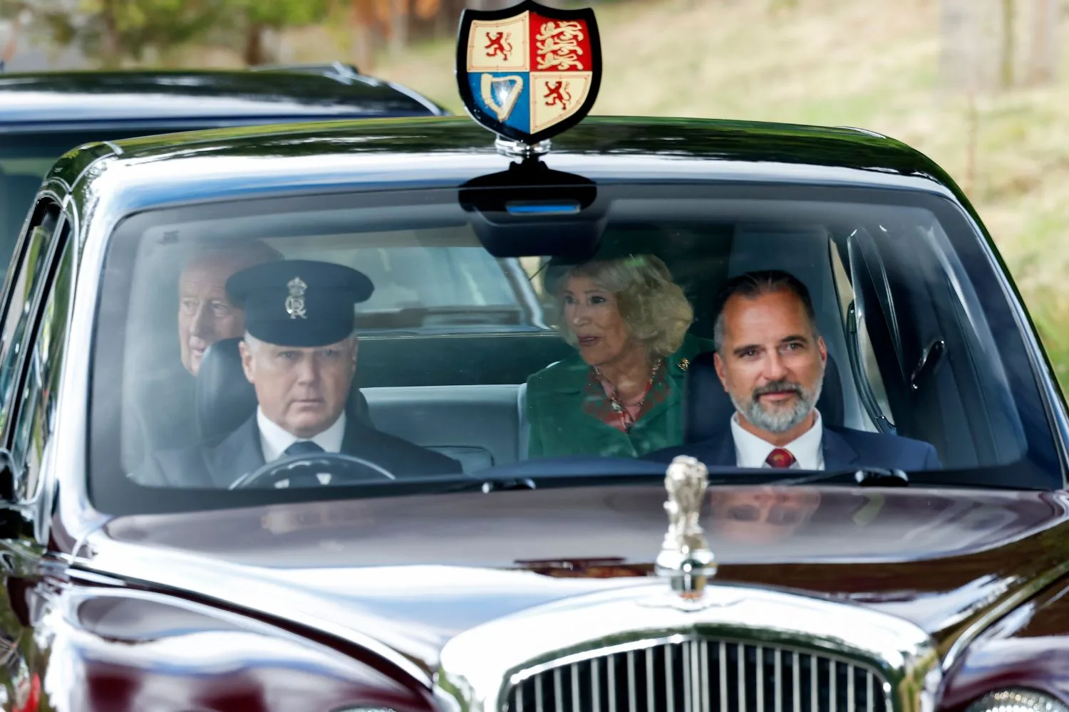 King Charles and queen Camilla being driven to church