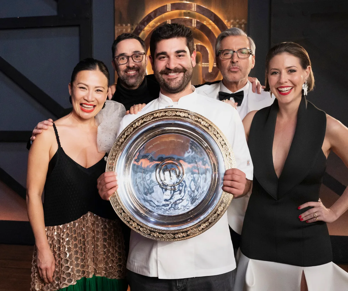 Vinnie Gibaldi surrounded by the judges as he holds the MasterChef Australia 2026 trophy.