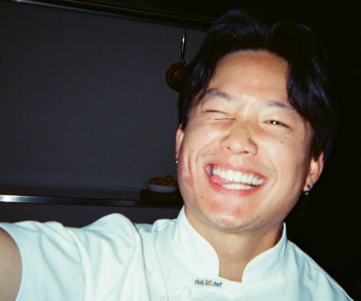Aaron Kher taking a selfie smiling in his MasterChef Australia chef whites.