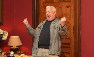 Ian "Dicko" Dickson celebrating in The Traitors Australia manor.