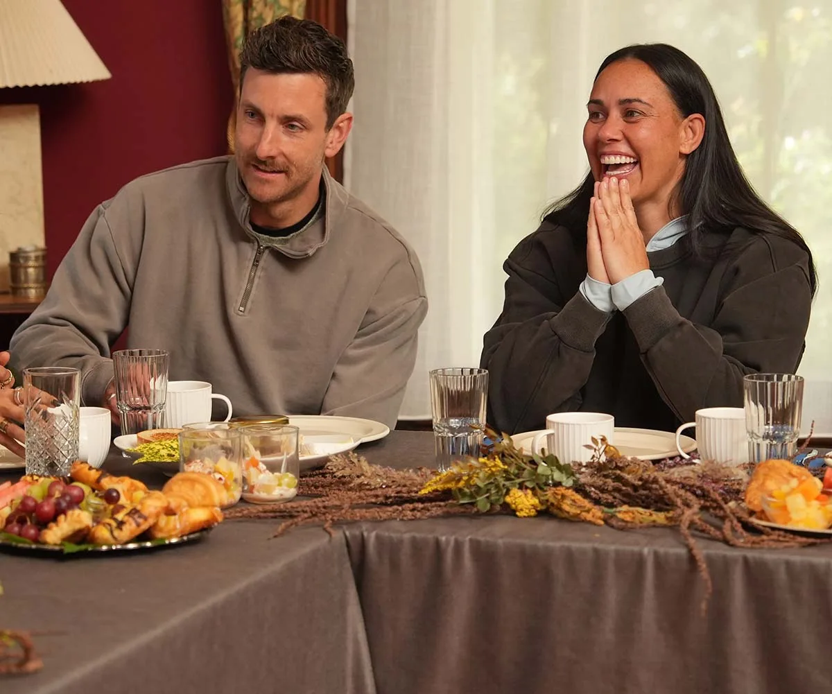 Henry and Kirby sit next to each other at a breakfast table