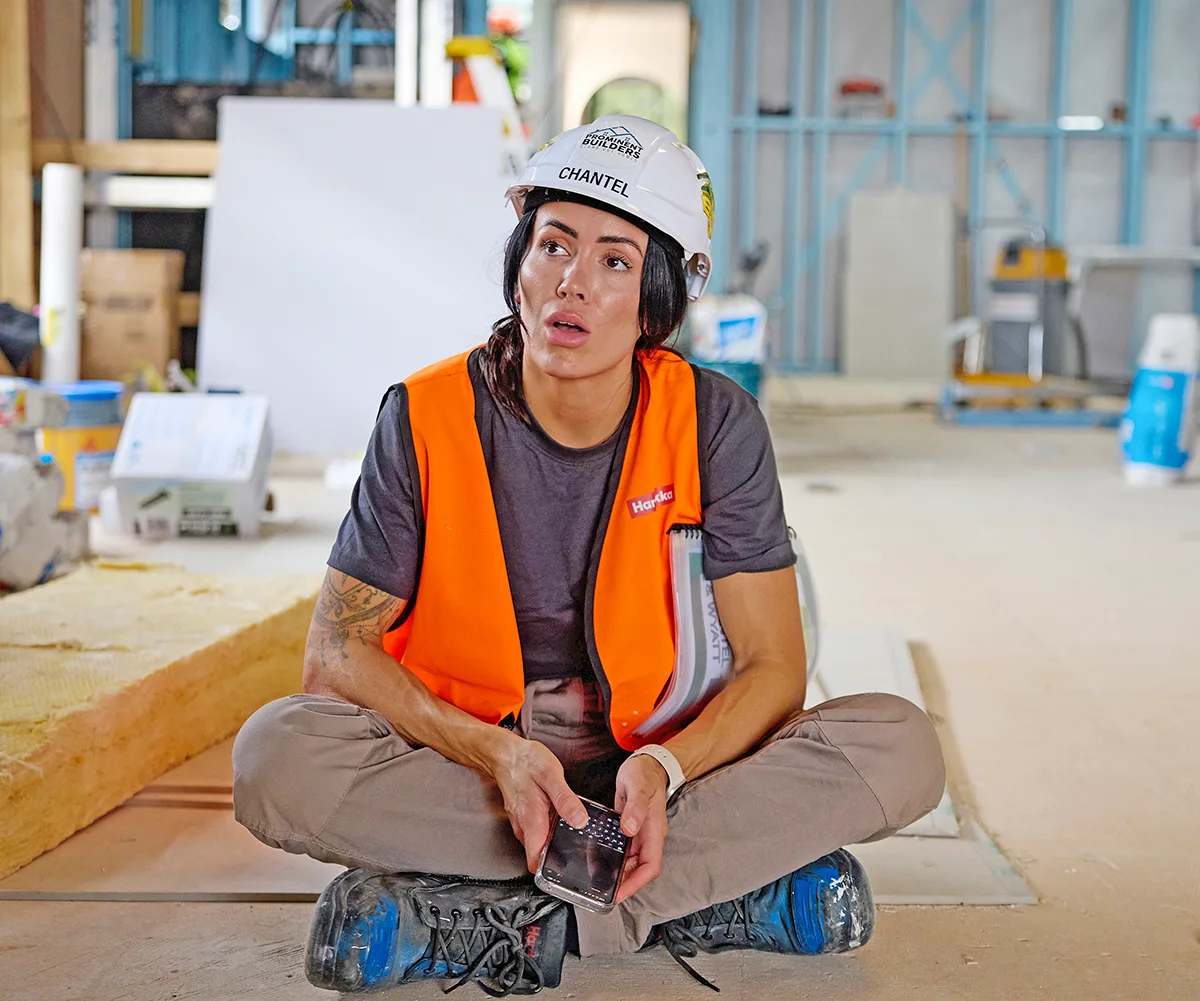 Chantel sits on the floor on site of The Block.