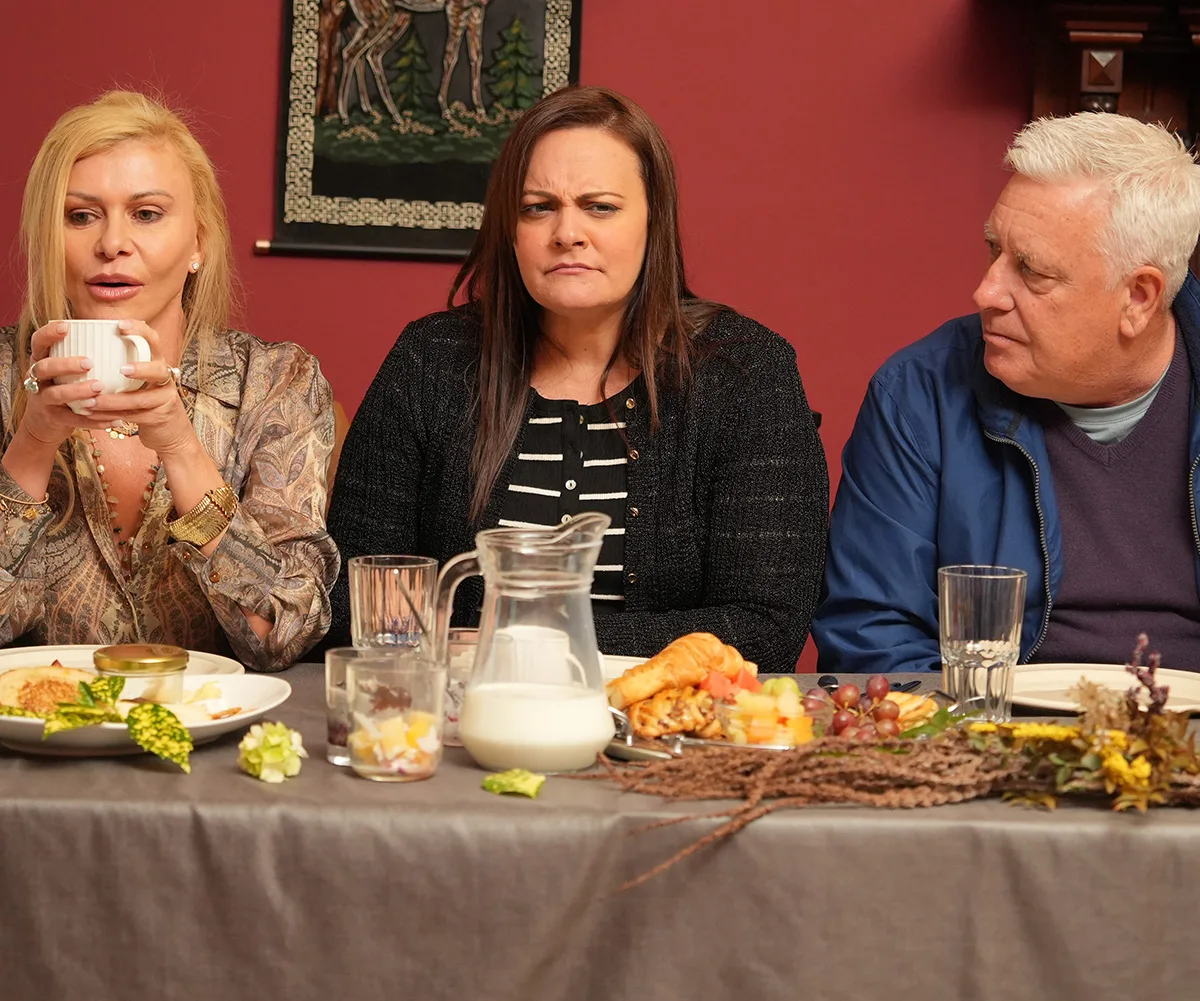 Gamble, Cossima and Dicko at a feast filled table on The Traitors Australia.