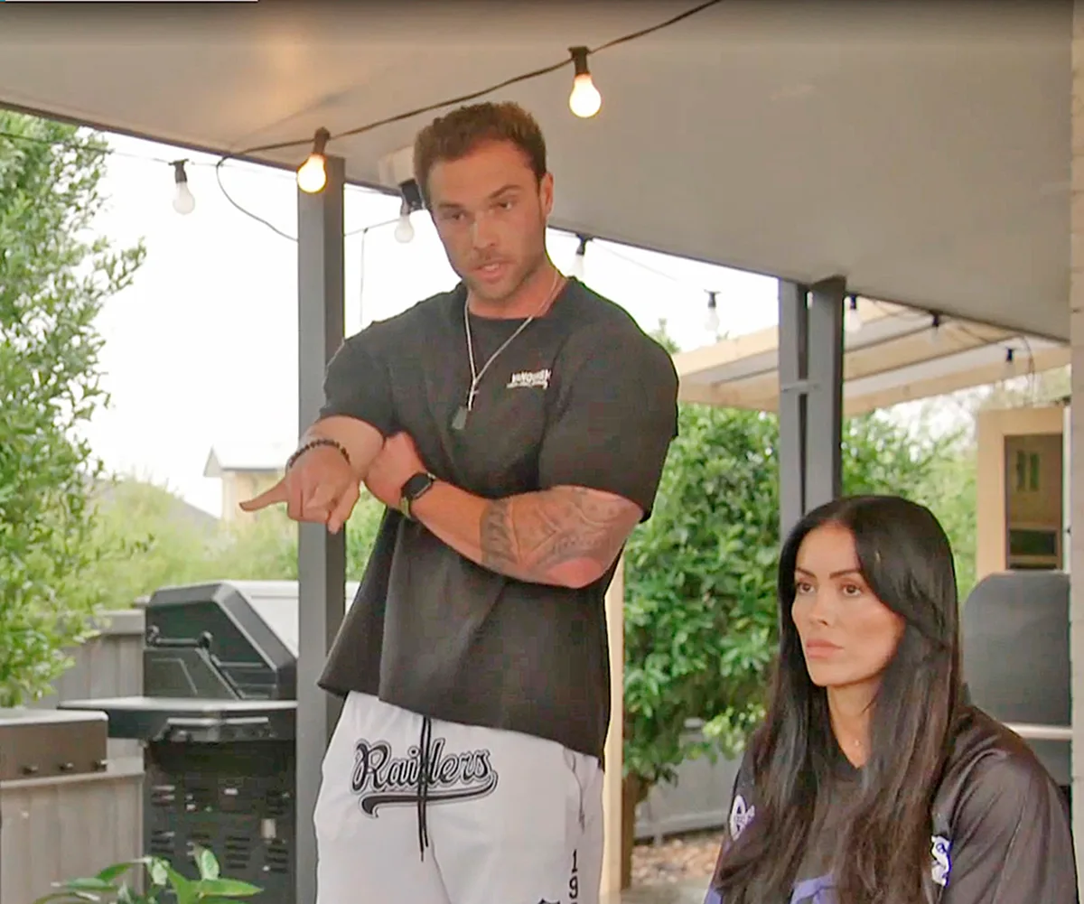 Wyatt is pictured st6anding, pointing at production next to Chantel.