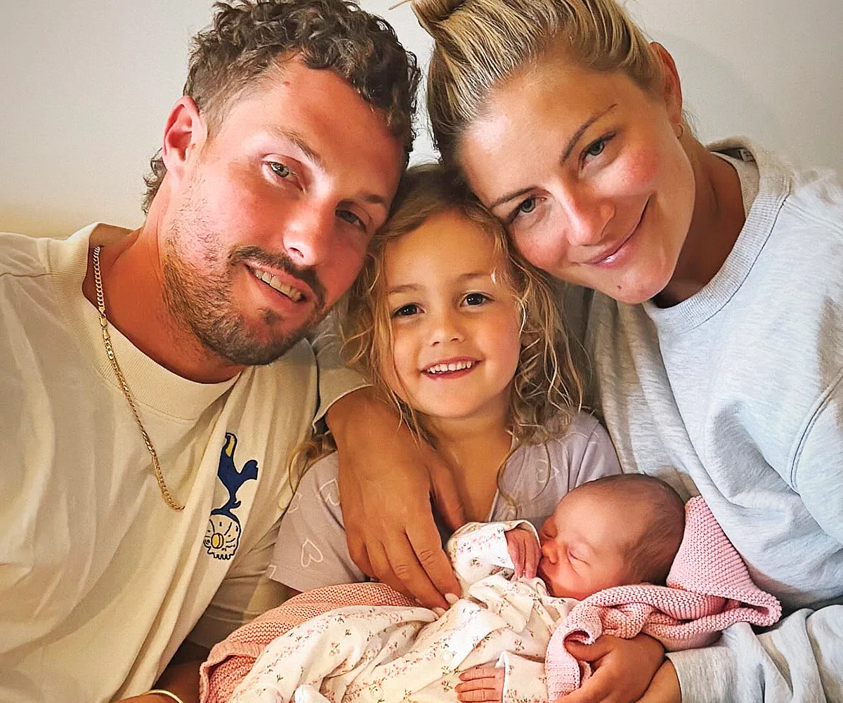 Luke Packham pictured with wife Olivia and two children.