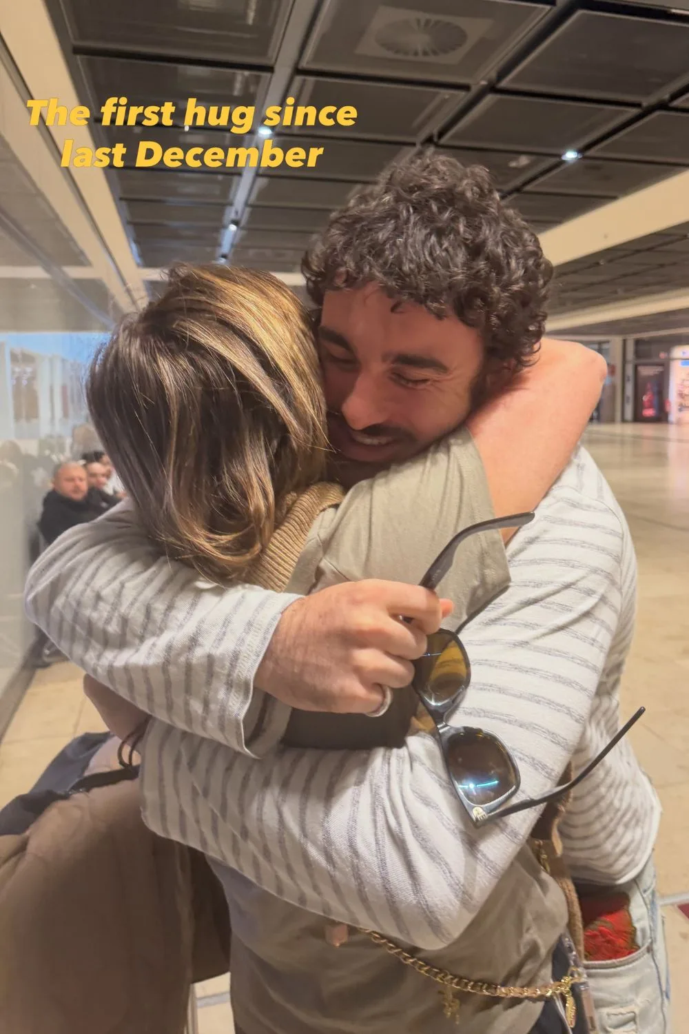 Kylie Gillies hugs her son Gus