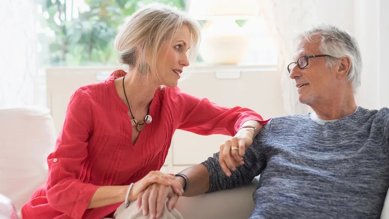 Older woman asking male partner health questions