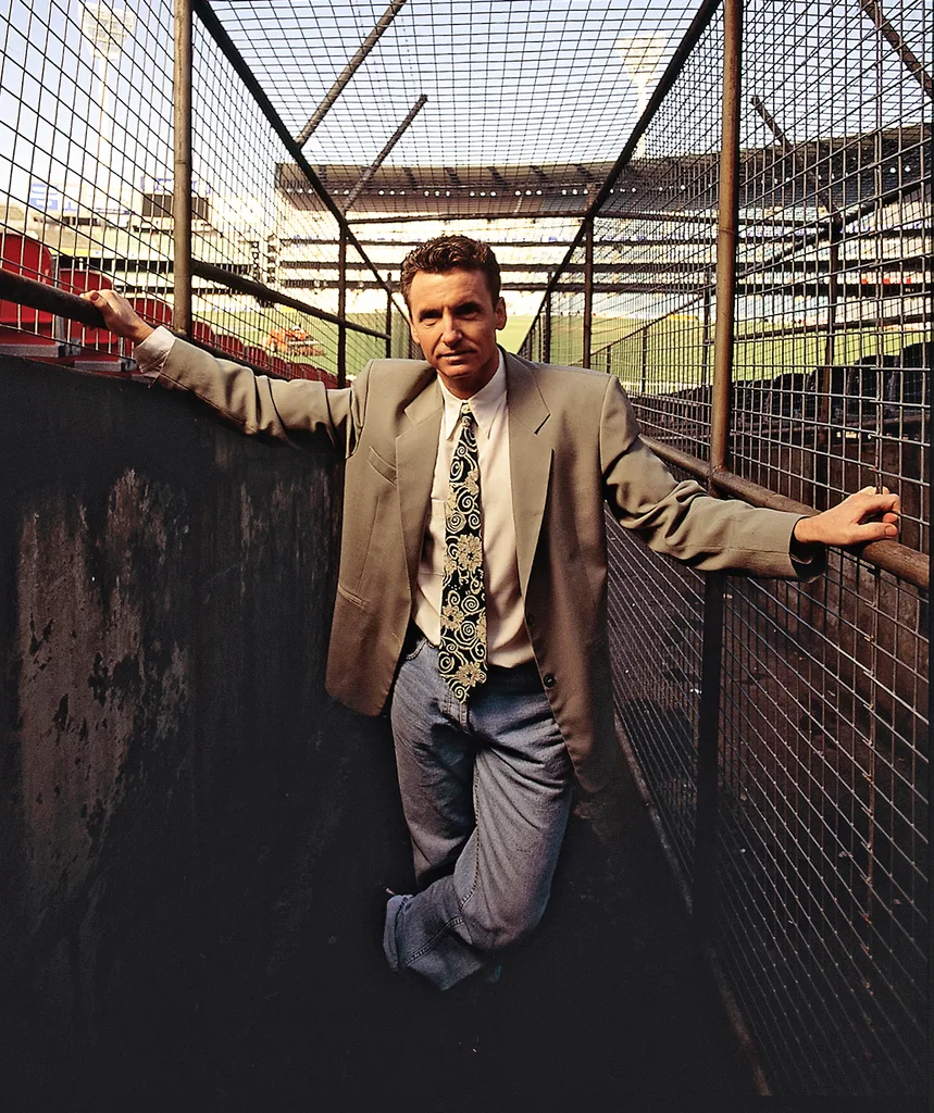 Bruce in his younger days as a reporter on Sportsworld.