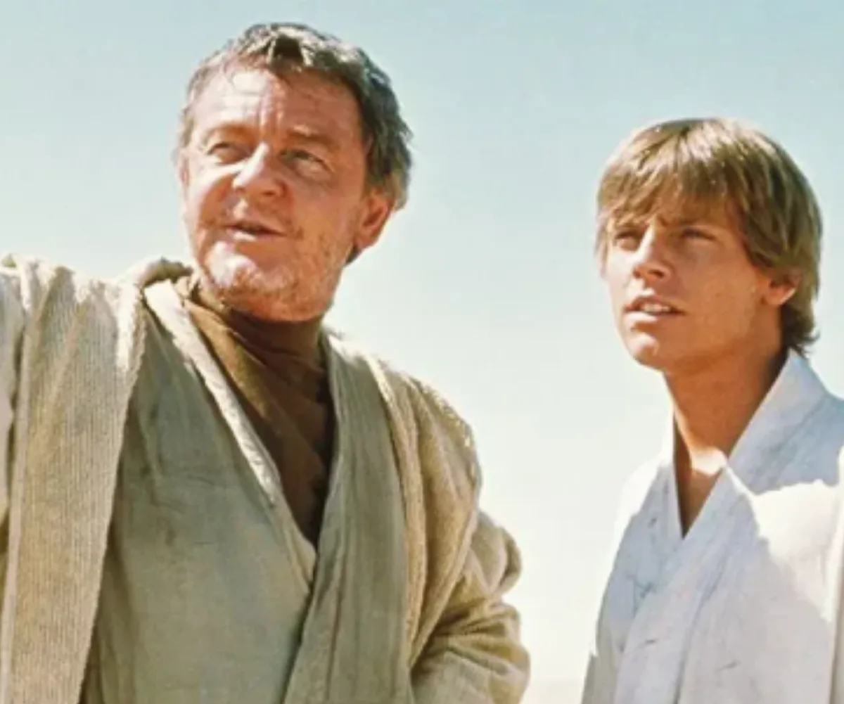 Uncle Owen chats to Luke Skywalker  in Star Wars