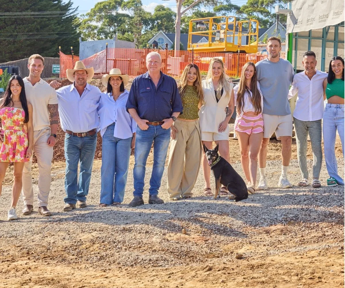 The 2026 Block cast with host Scott Cam in the centre, all smiling on the Block building site.