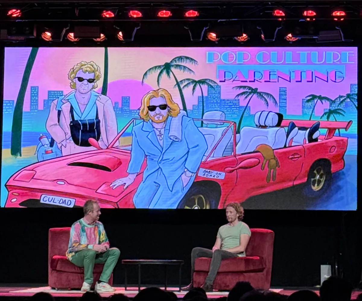 Pop Culture Parenting podcasters Billy and Nick chat on stage at their live show