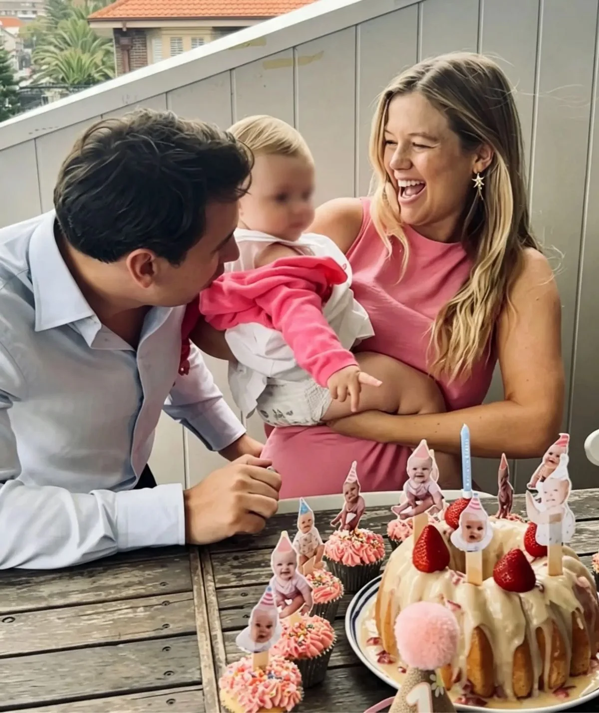 Leah Stewart holding her daughter August while husband Fernando looks on 