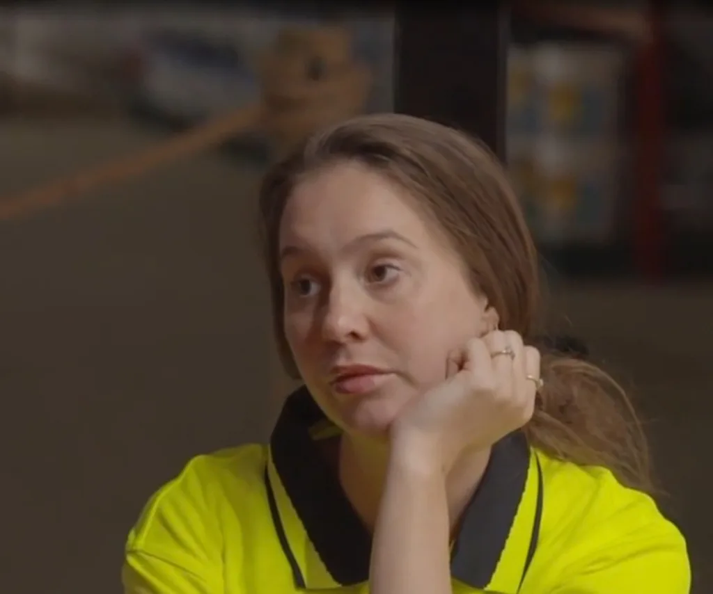 Lisa looking unimpressed in hi-vis on The Block.