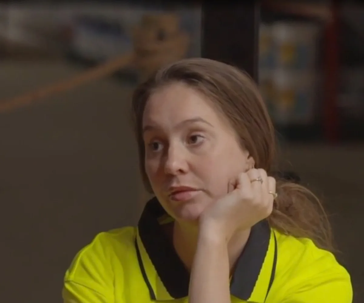 Lisa looking unimpressed in hi-vis on The Block.