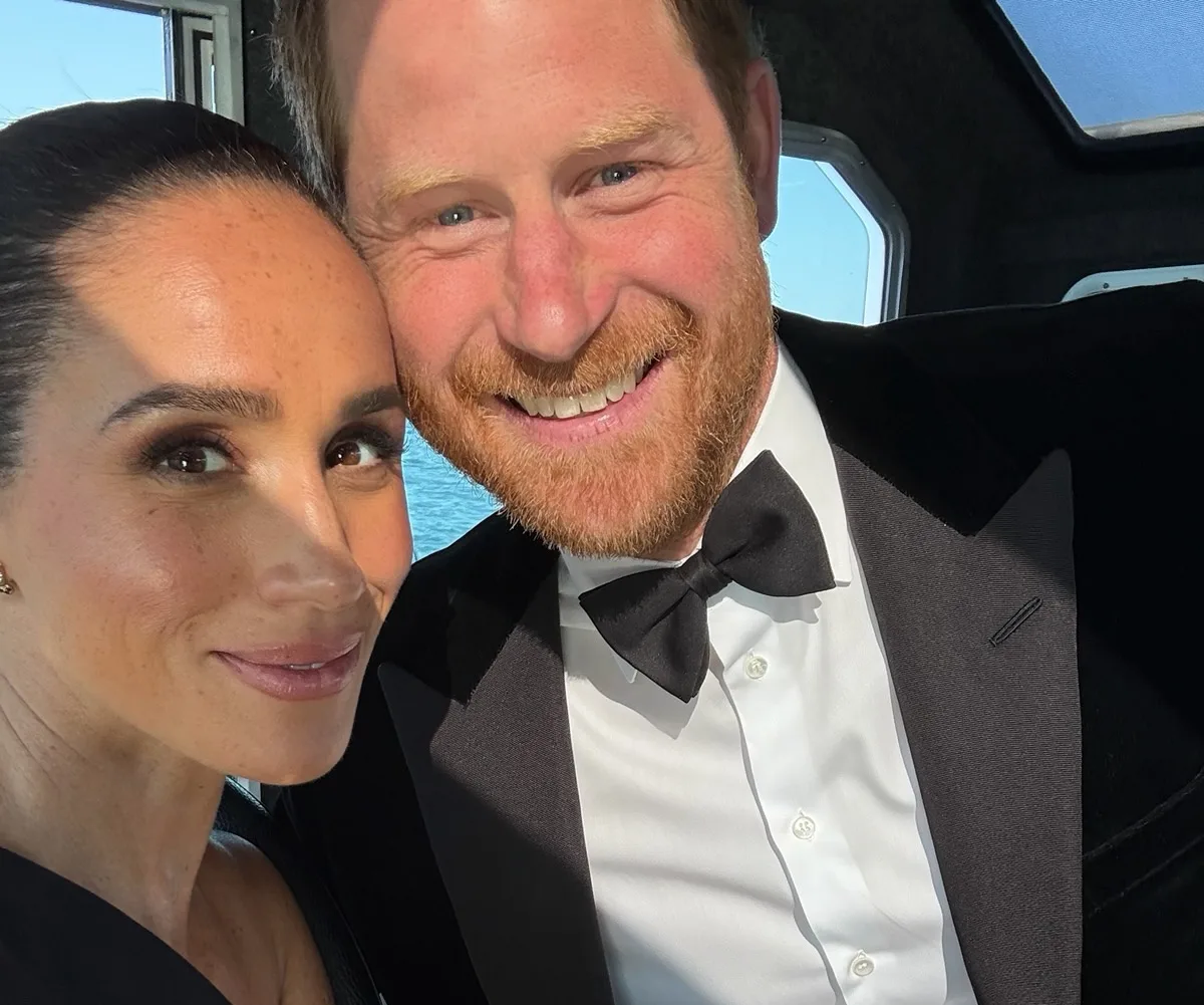 Meghan Markle and Prince Harry smile for selfie