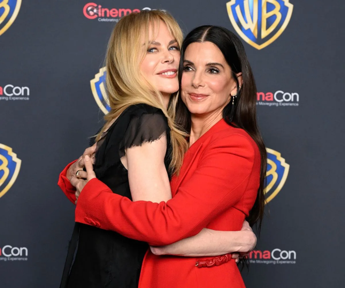 Nicole Kidman and Sandra Bullock hugging at the Practical Magic 2 premiere
