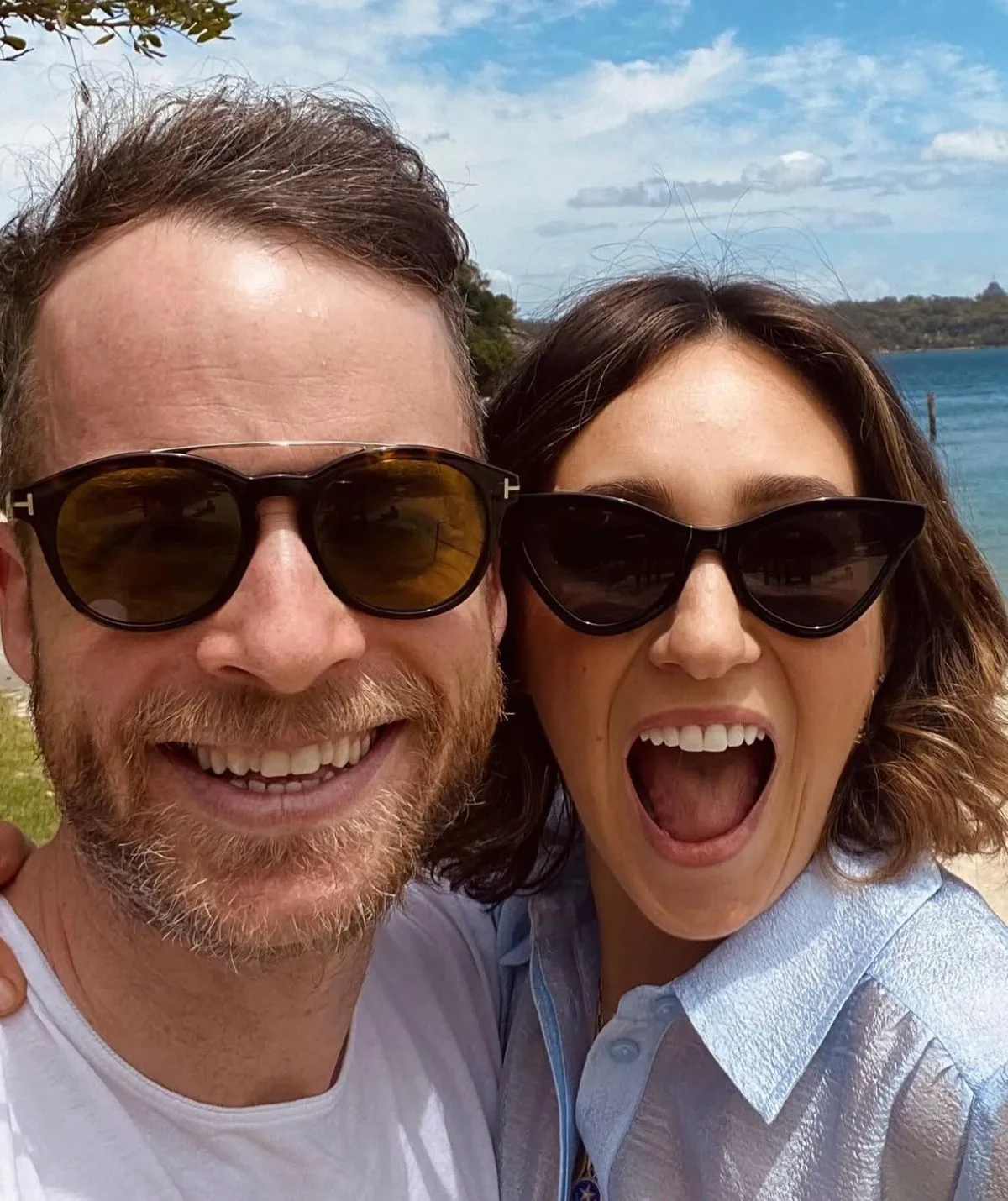 Hamish Blake and Zo&euml; Foster-Blake smiling and taking a selfie at the beach
