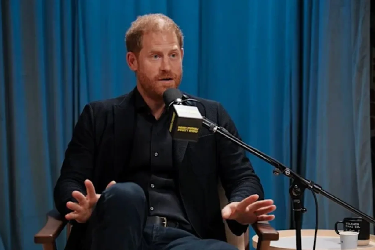 Prince Harry sitting in front of microphone