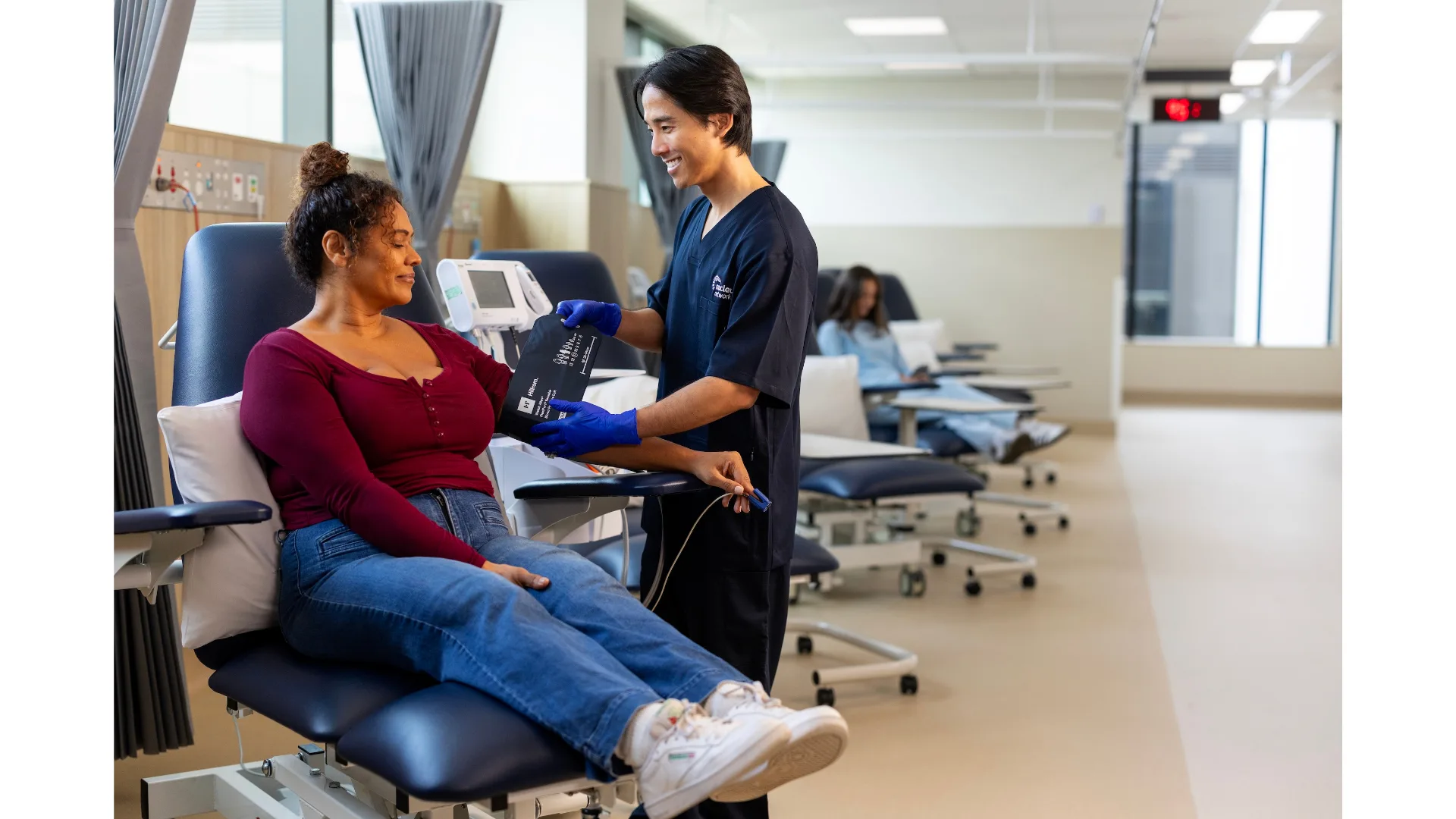 A female patient gets her blood pressure checked.