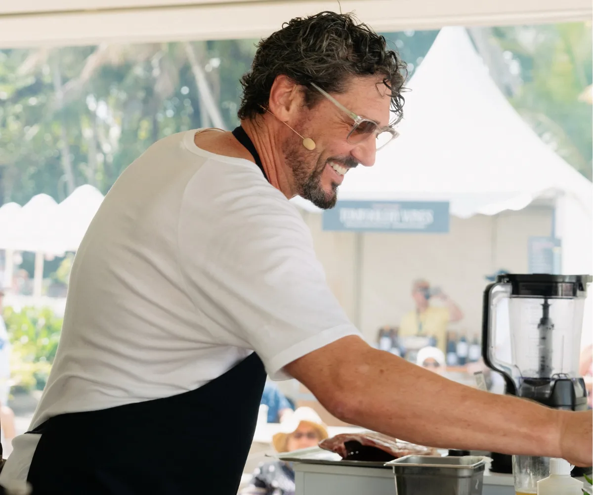 Colin is outside cooking at a demonstration