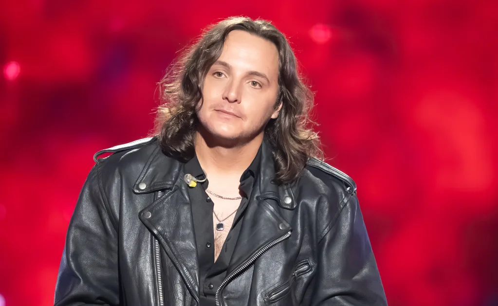 Jack, wearing a leather jacket, on the set of The Voice