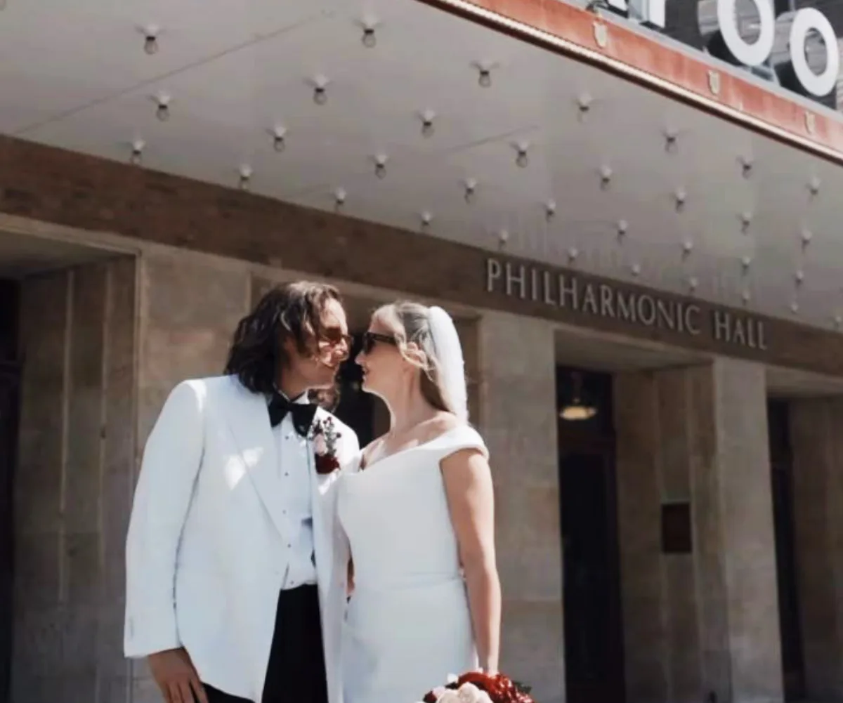 Jack kisses Abi outside building in Liverpool