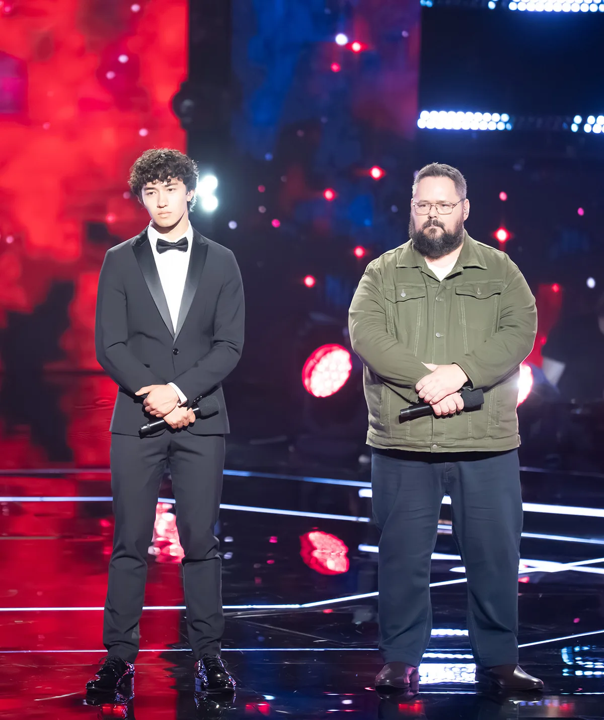 Saem stands next to Dicko on the set of The Voice