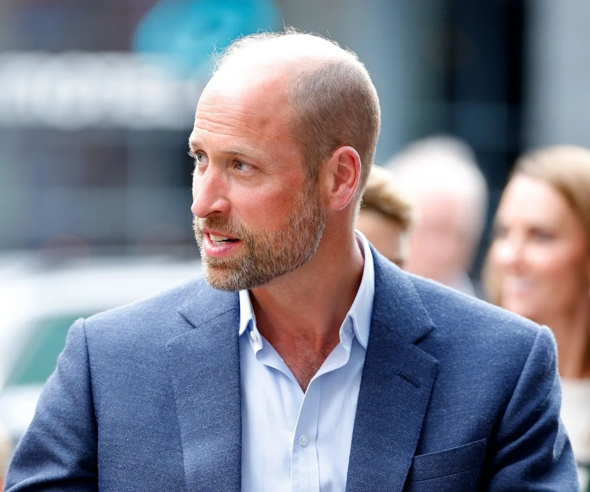 Prince William wearing blue blazer and light blue shirt