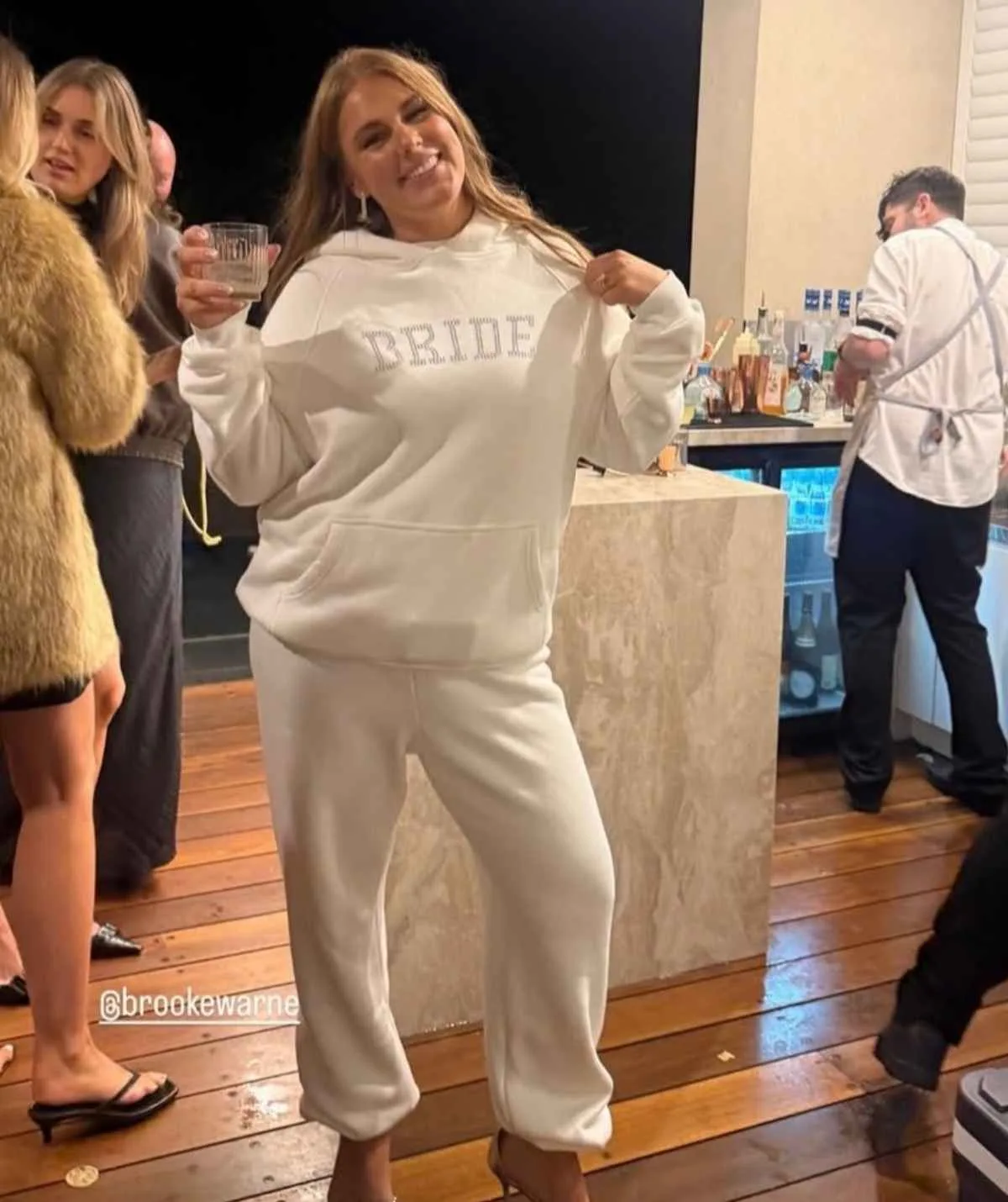 Brooke Warne wearing a 'Bride' tracksuit