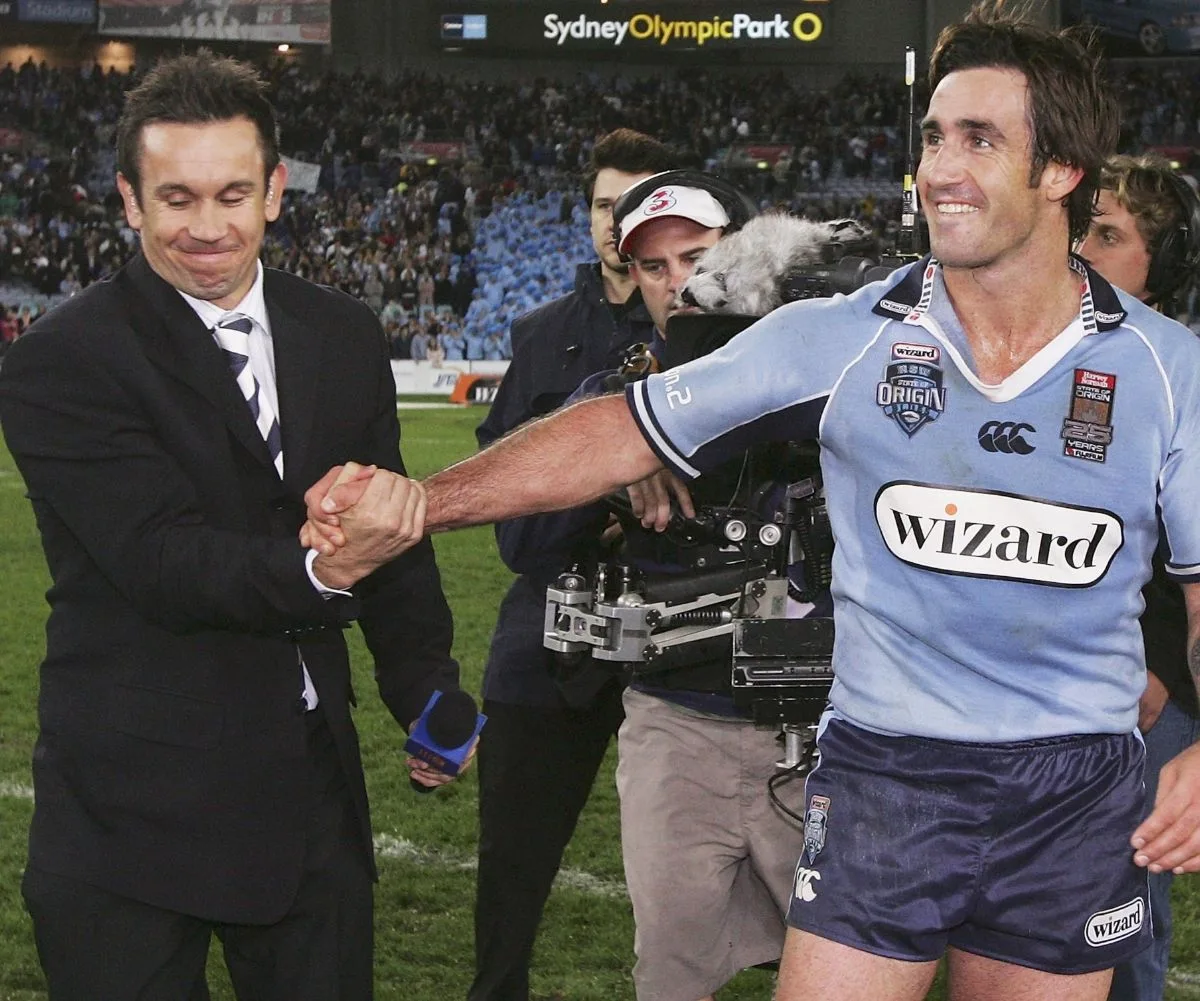 Matty J n a suit and Andrew Johns in NSW state of origin jersey 