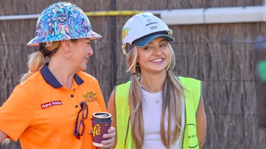 Courtney and Sev smiling on The Block.