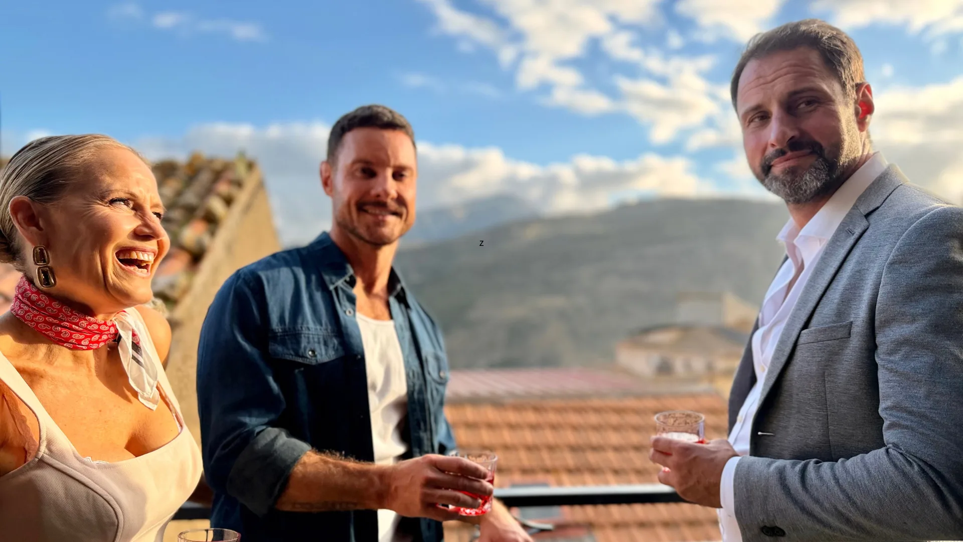 Shaynna Blaze, Darren Palmer and Scott Thompson on a balcony in Sicily.