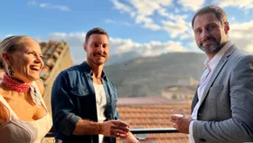 Shaynna Blaze, Darren Palmer and Scott Thompson on a balcony in Sicily.