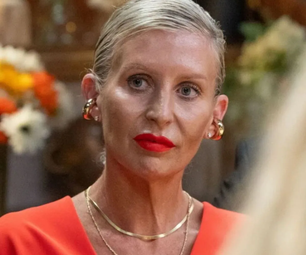 Jane on My Kitchen Rules wearing bright orange dress and big gold hoops