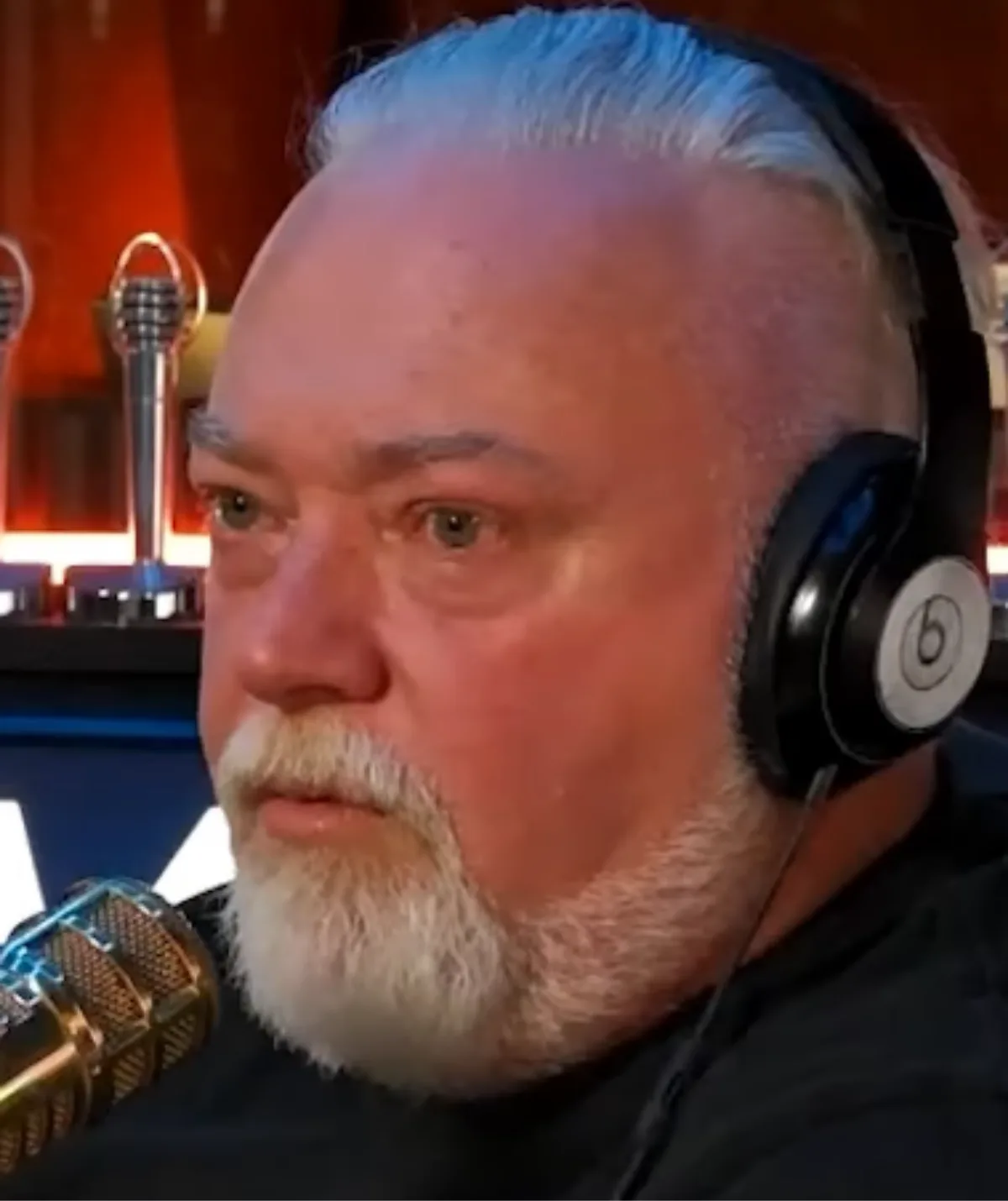 Kyle Sandilands talking on his radio show Kyle Sandilands live wearing headphones