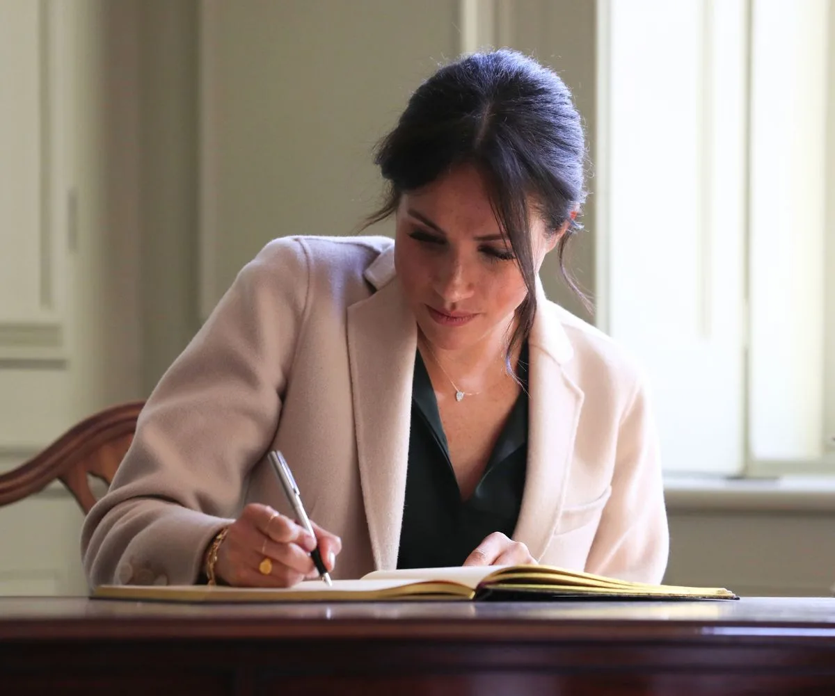 Meghan Markle writing in a diary